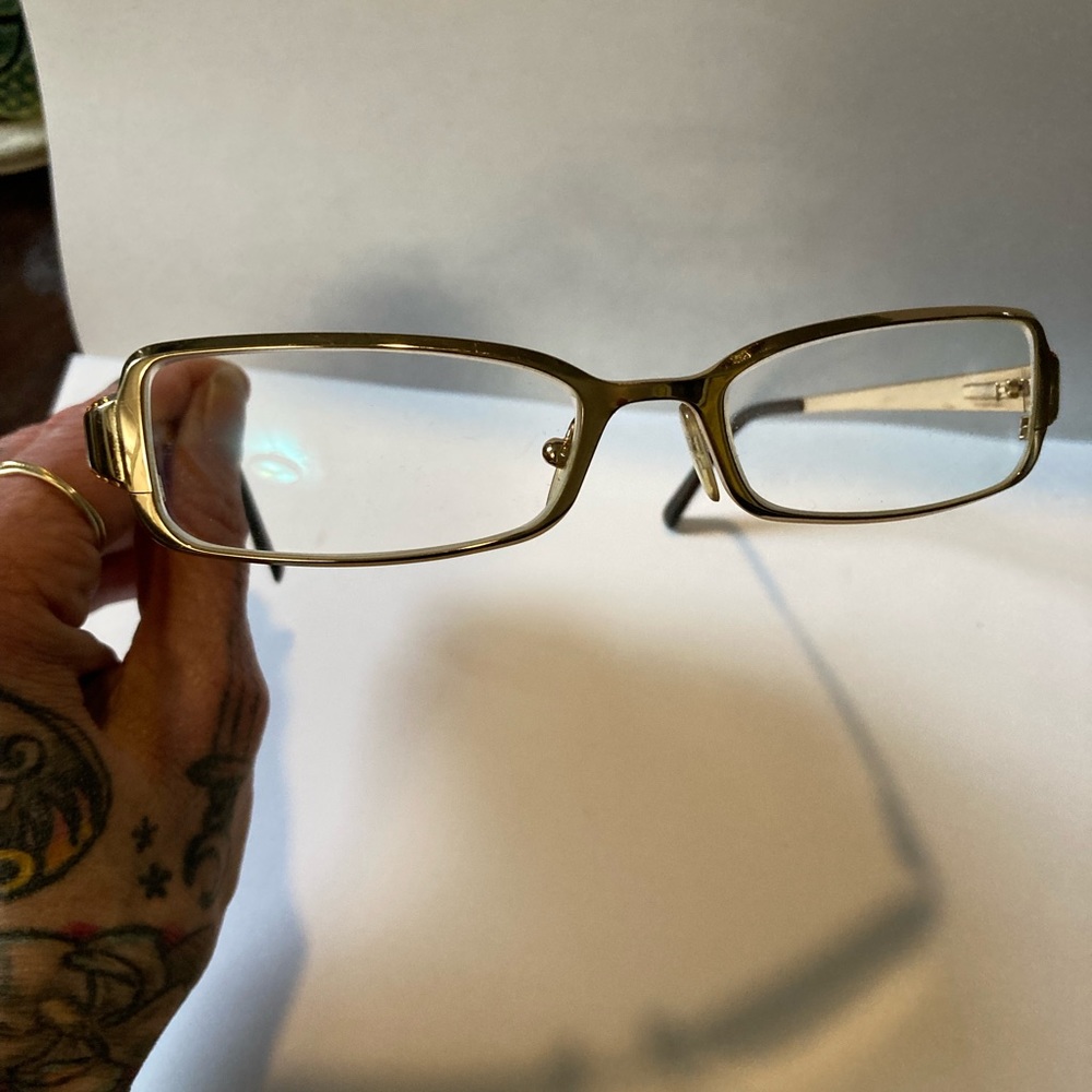 Stunning Prada reading glasses. In like new condition. Shiny gold w gems.